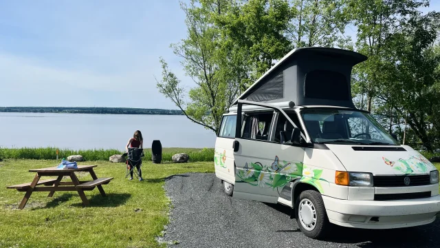 Nomad Junkies installs their RV on the riverfront at the Halte camping Lotbinière in the village of Lotbinière.