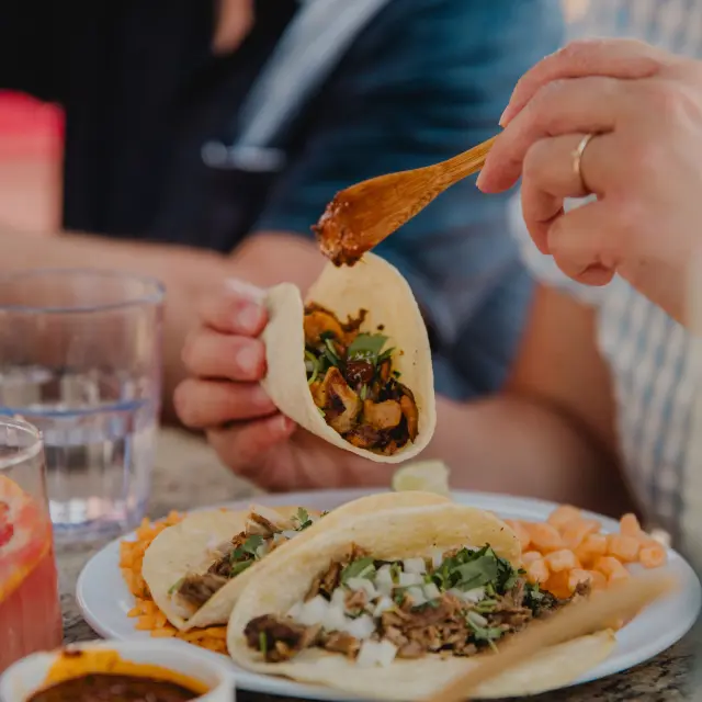 Enjoy a plate of tacos on the outdoor terrace of Los Balderas restaurant